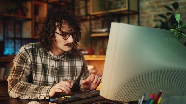 Man throwing a tantrum after struggling with computer project in retro workplace