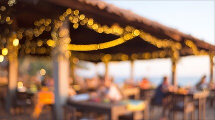 Naklejka premium Blurred view of a cozy outdoor dining area adorned with string lights under a wooden roof.
