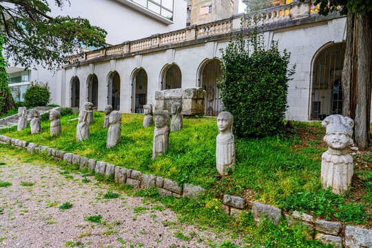 Rijeka, Croatia, 17 April 2025 - Statues of History (Adamicevi svjedoci) next to the Maritime and History Museum of the Croatian Coast