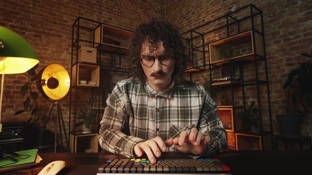 POV of funny IT specialist wiping screen and typing in on keyboard retro office
