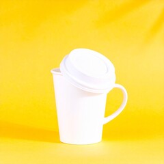 Generated image White Coffee Cup Mockup with Lid on Yellow Background