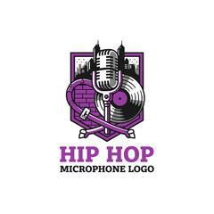 Obraz premium Cool hip hop logo featuring a microphone, vinyl record, and city skyline.