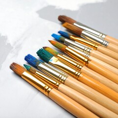 Fototapeta premium Paintbrushes arranged in a variety of sizes and colors