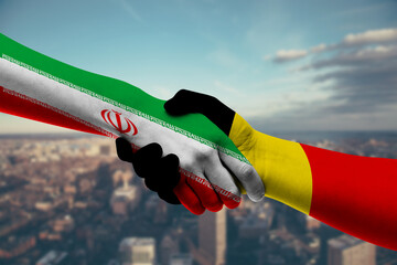 Shaking hands Iran and Belgium