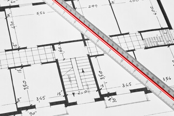 BUILDING PERMIT DOCUMENT WITH ARCHITECTURAL BLUEPRINT of an old residential building - Concept of construction, real estate development, and planning approval