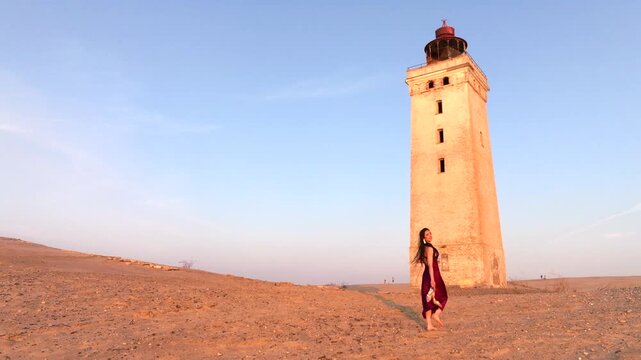 Aerial view of the giant sand dunes with the famous lighthouse on the top of a hill. Rubjerg Knude Lighthouse, , North SeaRubjerg , Sunset at the lighthouse Rubjerg Knude Fyr near Lokken in Denmark. 