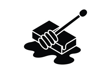 Black and white honey block with dipper and dripping honey