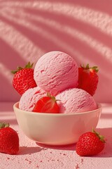 Fresh strawberry ice cream in a bowl with whole strawberries on a pink background