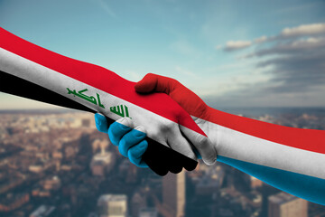 Shaking hands Iraq and Luxembourg