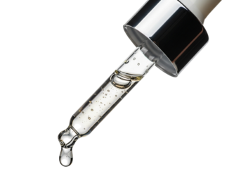 Close-up macro shot of a glass dropper with clear liquid dripping onto a dark surface for beauty products transparent background