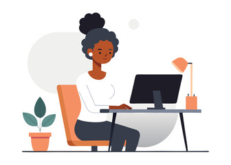 African American woman working from home on computer at desk