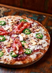 Pizza with salami, mozzarella cheese and jalapeno pepper. Wooden background. Soft focus. Copy space. .