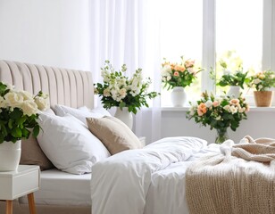 Fototapeta premium White Bedroom Decorated with Fresh Flowers and Plants.