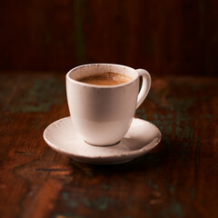 Cup of coffee on wooden background. Soft focus. Copy space	