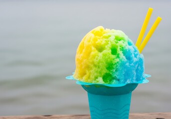 Hawaiian Shaved Ice in Blue Cup with Colorful Syrup – Summer Dessert by the Sea