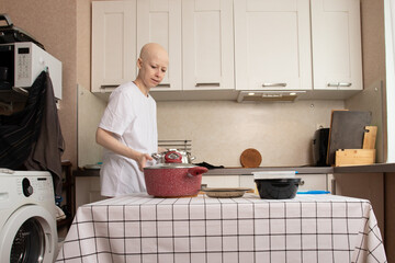 Serious woman in casual clothes preparing ingredients for meal, standing in kitchen with cookware...
