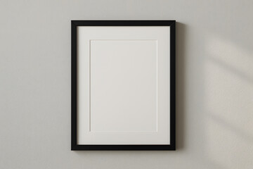 Empty Picture Frame on Wall: A classic black picture frame, mounted on a plain light-colored wall, its blank canvas ready for personalization, adding a touch of elegance to any interior decor.