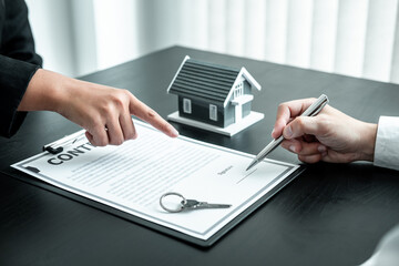 Estate agent are presenting home loan to client and discussing to decision signing agreement contract form, Home Insurance and Real estate investment concept