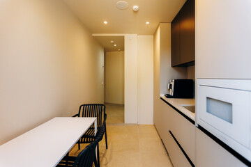 Modern Kitchen Interior Design Featuring a Cozy Dining Space for Comfort and Efficiency