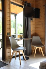 Table and chairs in stylish hotel room