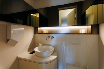 A modern minimalist bathroom with elegant fixtures and stylish elements for relaxation