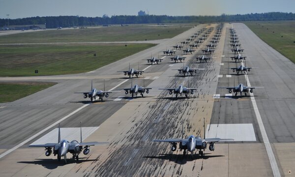 Formation of fighter jets on the runway, showcasing military power and aviation technology