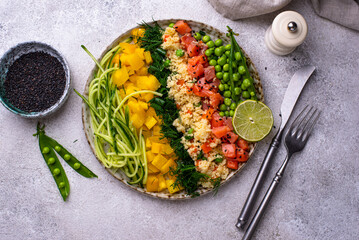 Healthy bowl with salmon and vegetables