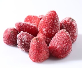 Pile of ripe frozen strawberries on white background, closeup