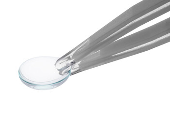 Tweezers with contact lens isolated on white