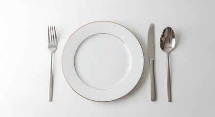 A white plate with fork, knife, and spoon isolated on white background