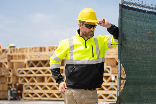 Supervisor engineer. Worker at construction site. Builder construction man. Worker supervisor at heavy machinery. Industry worker at construction. Builder civil engineer at building, copy space