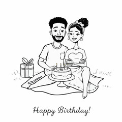 Happy couple celebrating birthday with cake and presents on grass  