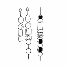 Hand-drawn jewelry beads in black and white on skewers  