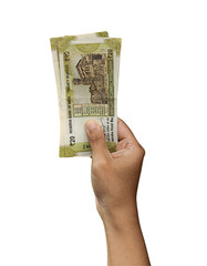 Hand holding multiple Indian currency cash banknotes  of 20 rupee in one hand