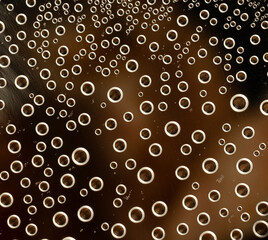Close-up of bubbles in dark liquid macro background