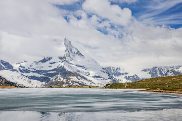 Snow-Capped Mountain and Serene Lake