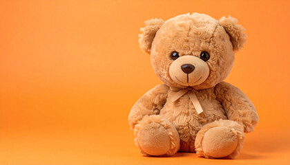 Obraz premium Cute Brown Teddy Bear Plush Toy on Orange Background, Adorable Soft Stuffed Animal, High-Resolution Toy Photography for Kids, Gifts, and Creative Projects