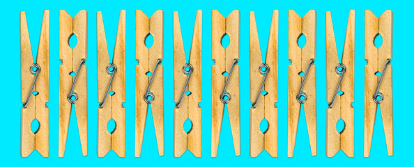 Minimalistic Wooden Clothespins on Cyan Background