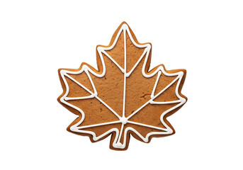 A decorative gingerbread cookie in the shape of a maple leaf, outlined with white icing, is featured against a black backdrop.