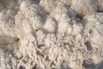 Close-up of naturally crystallized salt on the ground on the shore of the salt lake Baskunchak, Astrakhan region, Russia