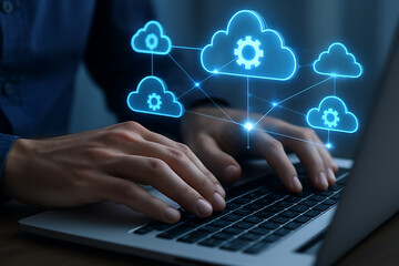 Cloud computing and digital network concept with glowing cloud icons and gears over laptop keyboard