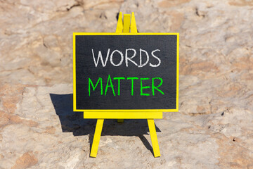 Words matter symbol. Concept word Words matter on beautiful black blackboard. Beautiful stone...