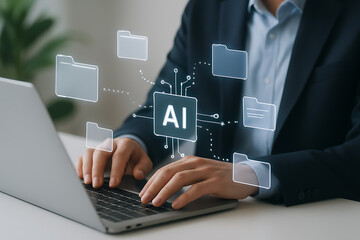 Business professional using laptop with artificial intelligence system managing digital folders representing automation efficiency and technology innovation
