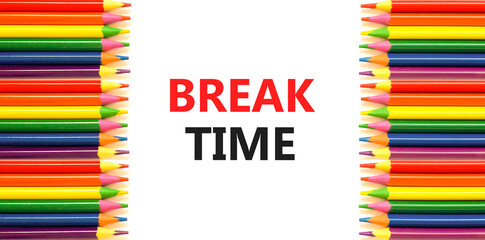 Break time symbol. Concept word Break time on beautiful white paper. Colored pencils. Beautiful white paper background. Business break time concept. Copy space.