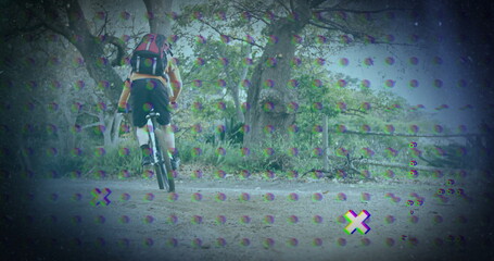 Riding cyclist pedaling through forest trail, with mountain bike, helmet, backpack, glitch effect