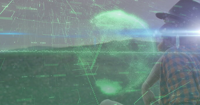 Scanning male in hat and plaid shirt on farmland at dawn showing holographic interface, copy space - Powered by Adobe