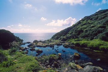 The coast between Tresnuraghes and Santa Caterina is formed by a long basalt cliff. Several streams flow into the sea in a waterfall from the top of the cliff. Cuglieri, Montiferru, Sardinia, Italy