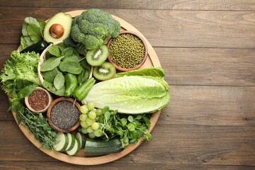 Superfood. Different healthy products on wooden table, top view. Space for text