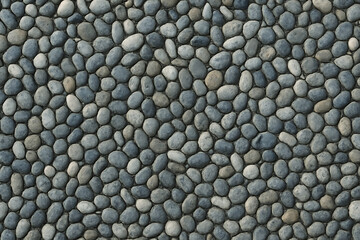 Close up view of a textured surface made of small rounded pebbles