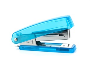 A clear light blue stapler isolated on a bright white background office equipment ready to staple